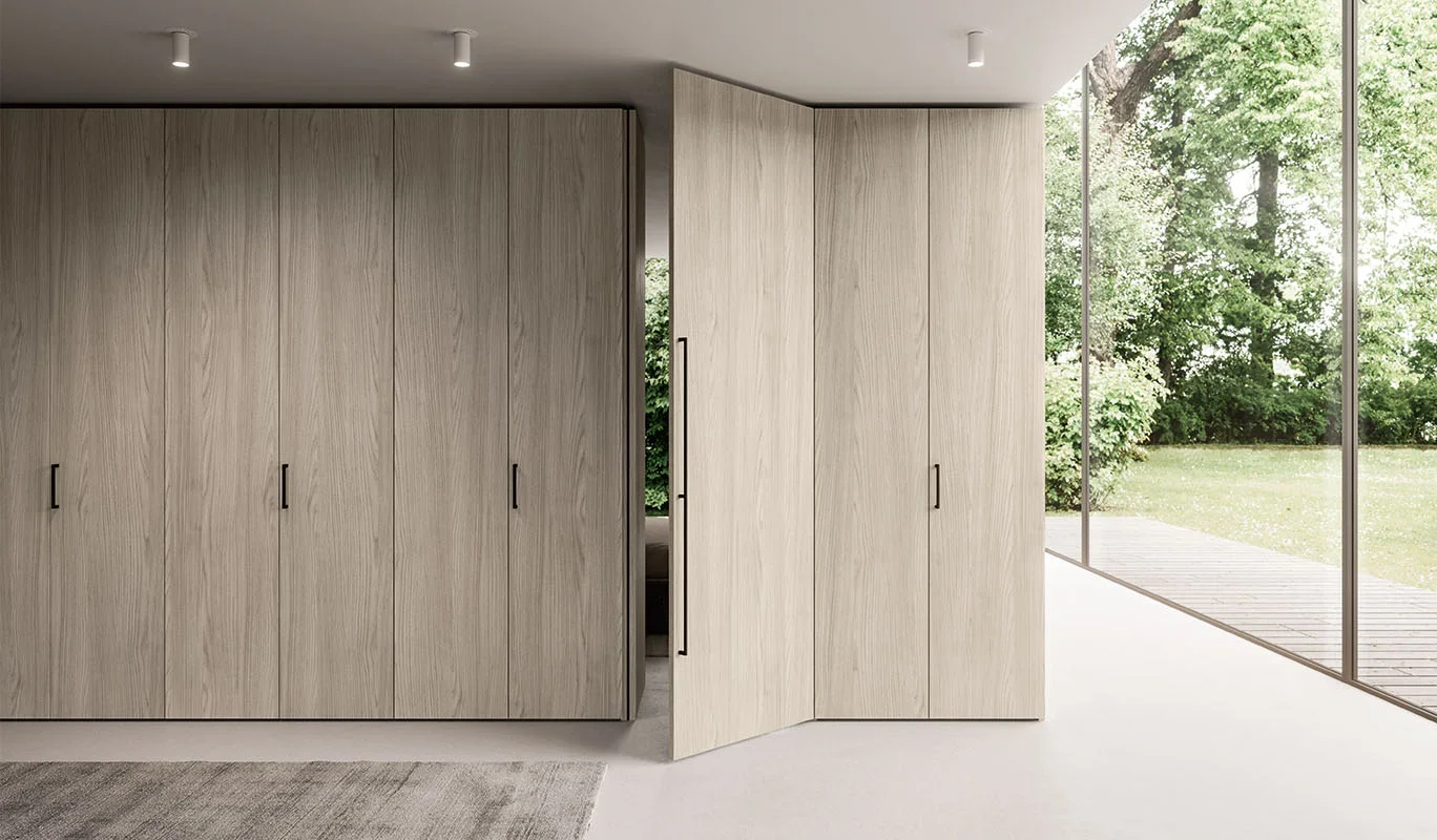 Italian Cinquepuntozero Design solutions wooden wardrobe with modern pivot doors and seamless design at ArkNova Interiors Paphos Cyprus