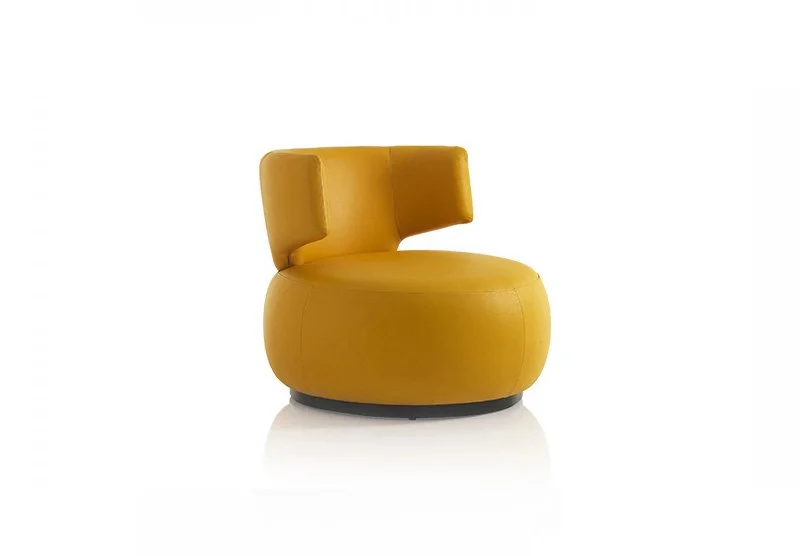 Albani Divani Coco Italian yellow leather curved swivel armchair at ArkNova Interiors Paphos showroom in Cyprus