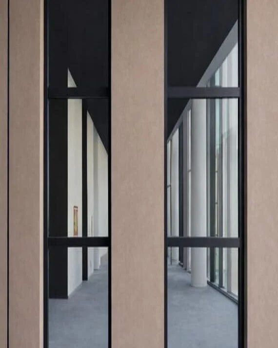 Novoferm Fixglass Italian dark framed glass fire-rated partition doors in modern corridor at ArkNova Interiors Paphos Cyprus