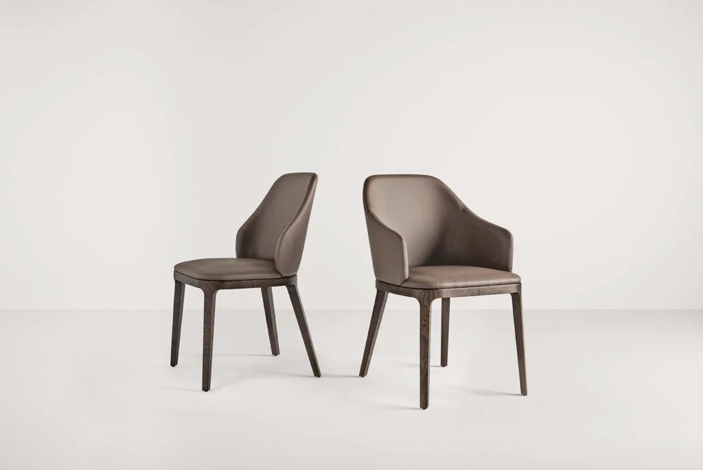 Frag Doa Italian brown leather dining chairs with wooden legs at ArkNova Interiors Paphos showroom in Cyprus