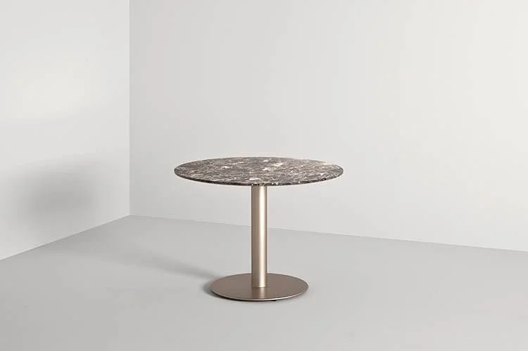Frag Doni 62:73 Italian round granite side table on slim metal pedestal, modern design at ArkNova Interiors Paphos showroom in Cyprus