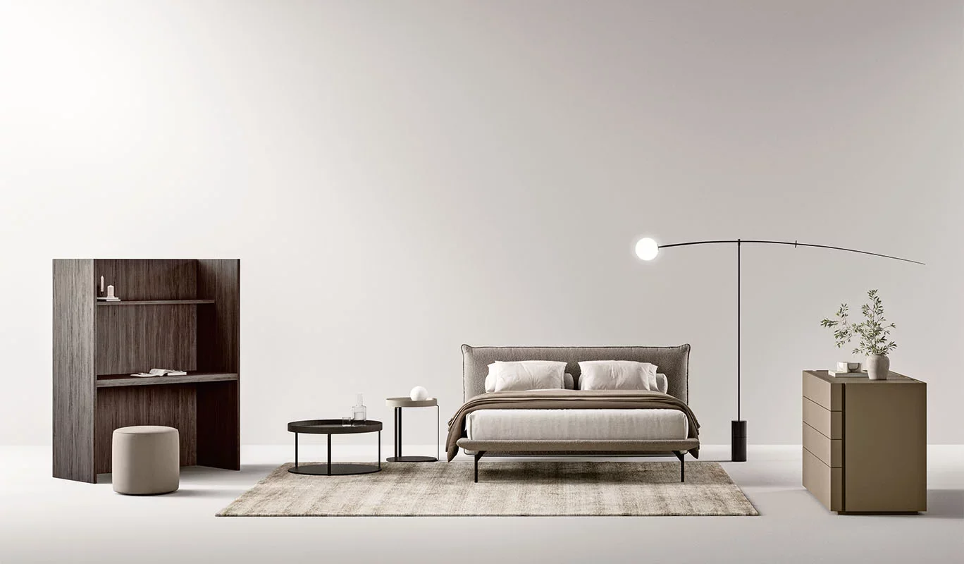 Italian Icaro bed by Cinquepuntozero with modern gray upholstered headboard at ArkNova Interiors Paphos showroom in Cyprus