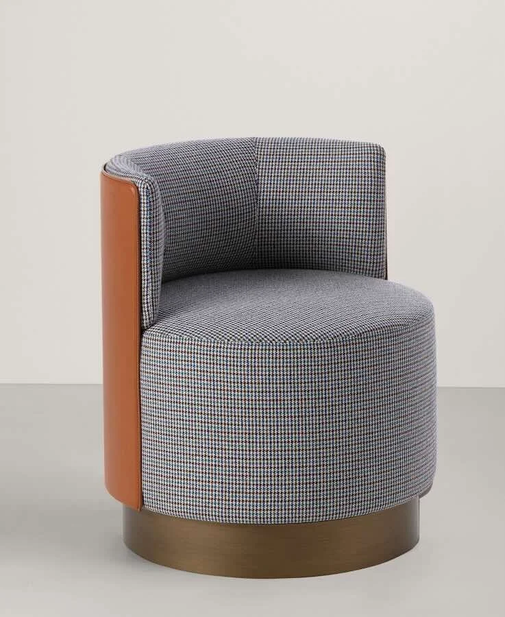 Frag Clubby dining Italian patterned fabric and leather swivel armchair at ArkNova Interiors Paphos showroom in Cyprus