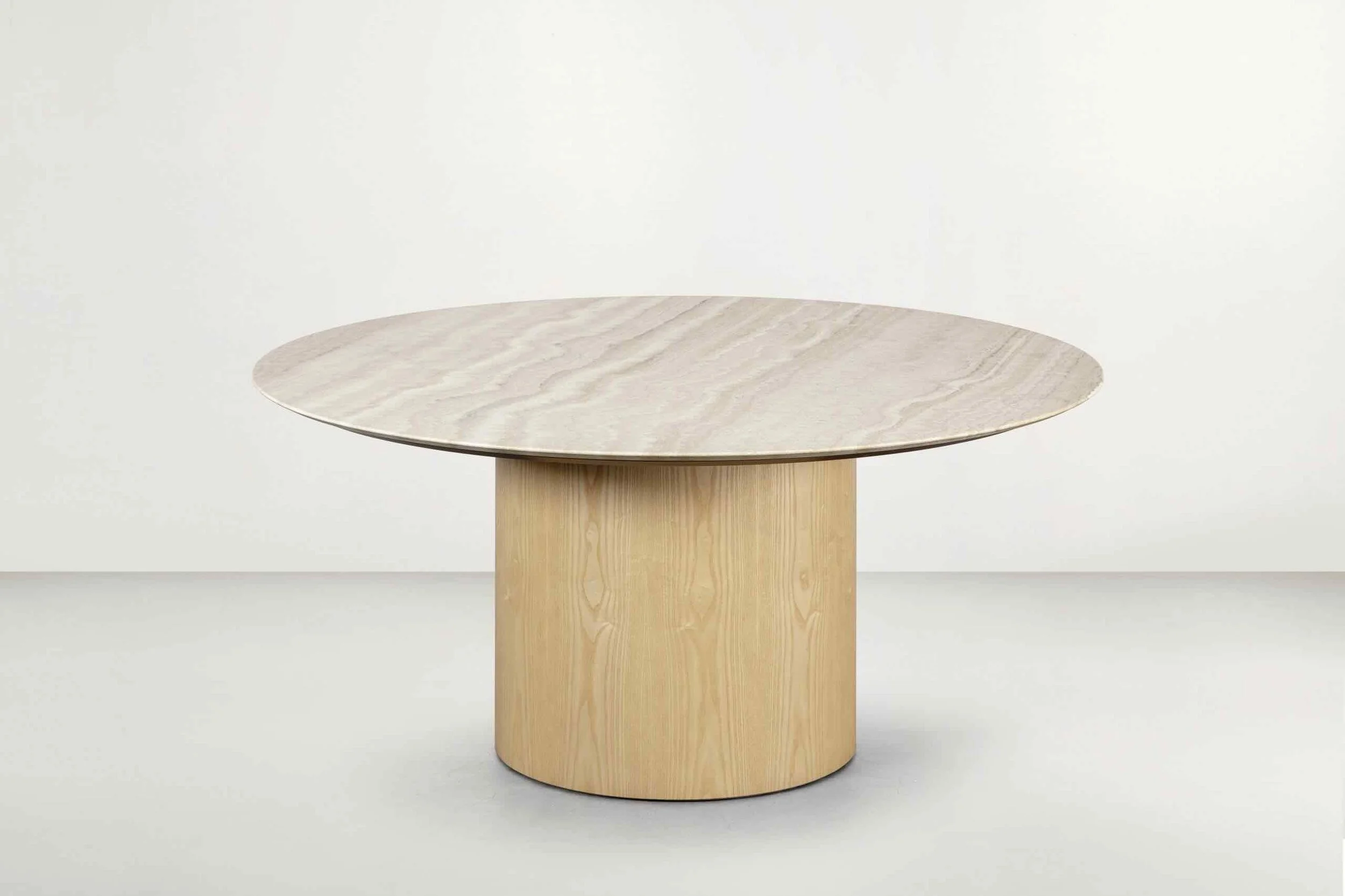Frag Myon 160-180 Italian round light wood dining table on cylindrical pedestal base, contemporary design at ArkNova Interiors Paphos showroom in Cyprus