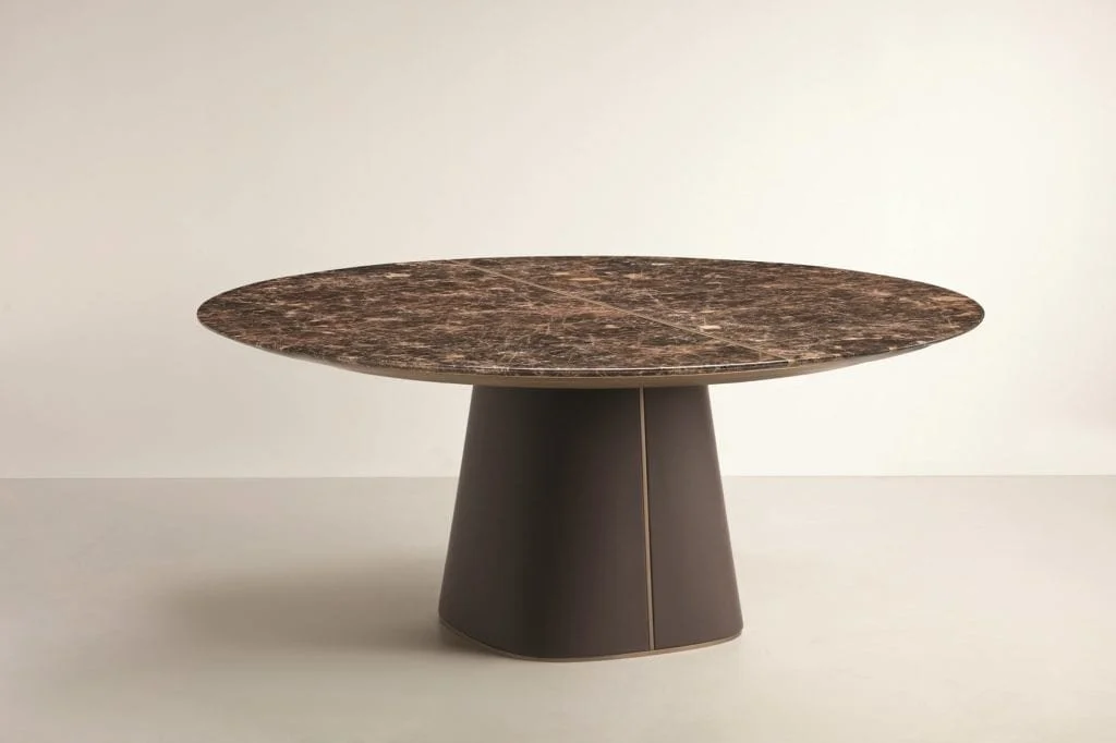 Frag Artù Italian round dark marble dining table on conical pedestal base, contemporary design at ArkNova Interiors Paphos showroom in Cyprus