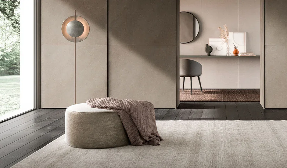Italian Cinquepuntozero Meti 90 modern beige fabric pouf with knitted throw at ArkNova Interiors Paphos showroom in Cyprus
