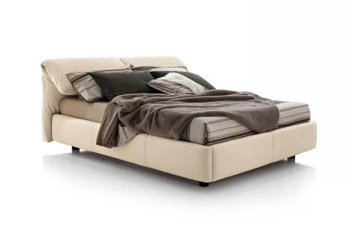 Italian Ventesimo LUX bed by Albani Divani with luxurious cream leather padded headboard at ArkNova Interiors Paphos showroom in Cyprus