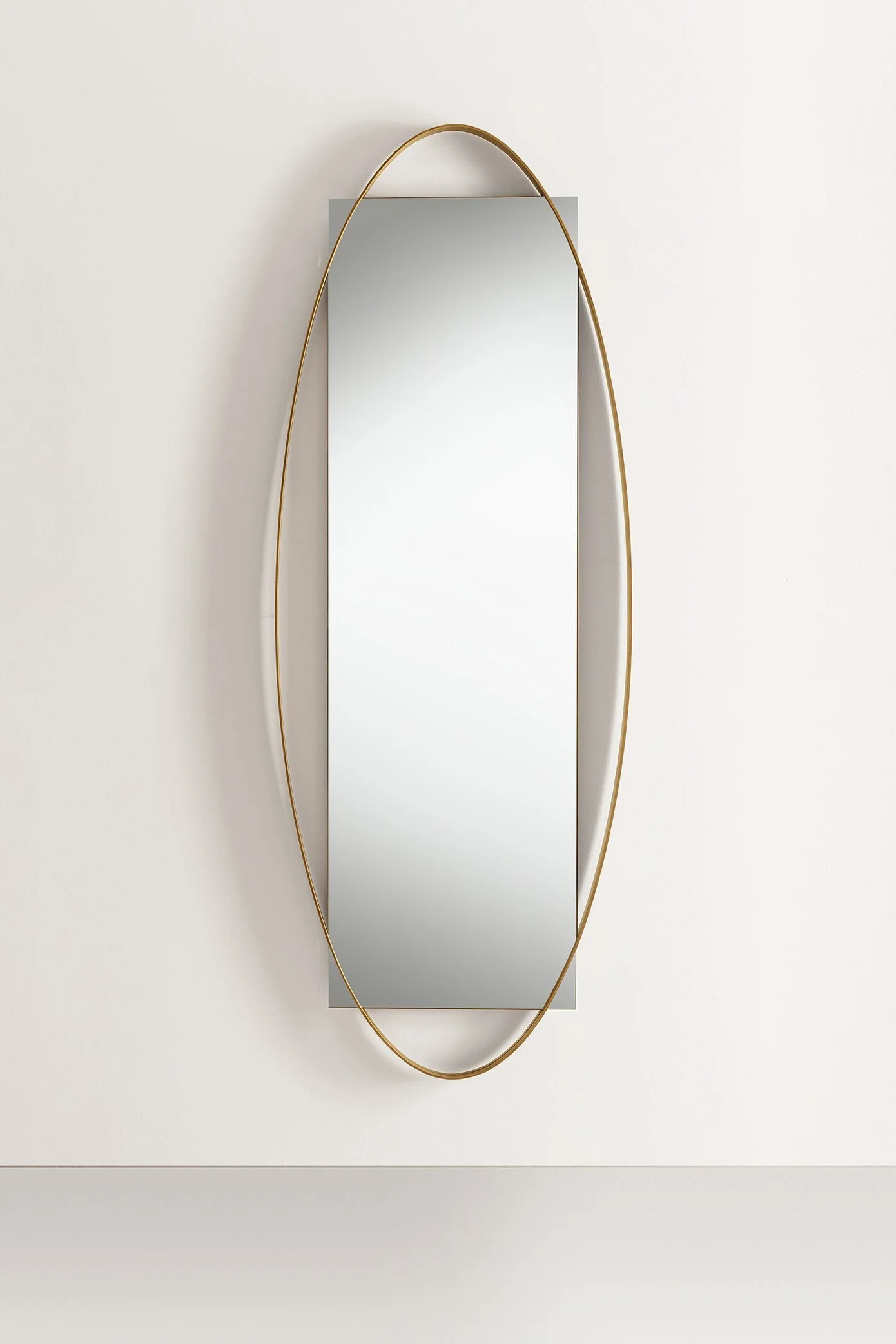 Italian Frag Twin Duo oval brass-framed wall mirror at ArkNova Interiors Paphos showroom in Cyprus