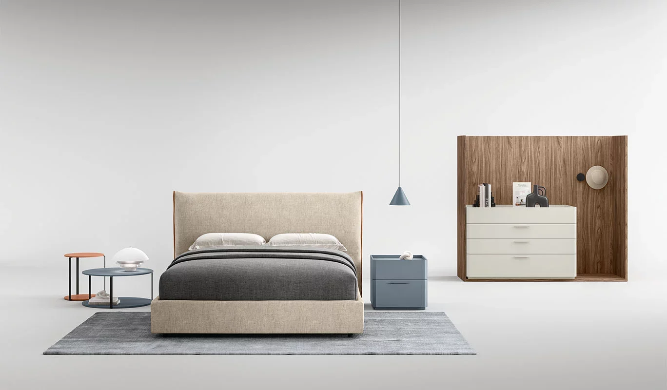 Italian Bilbao bed by Cinquepuntozero featuring beige fabric upholstery with warm wood details at ArkNova Interiors Paphos Cyprus