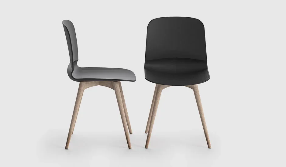 Cinquepuntozero Liù Italian black leather dining armchair with oak legs at ArkNova Interiors Paphos showroom in Cyprus