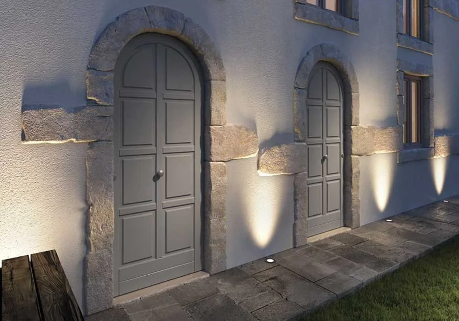 COCIF premium Italian arched entrance doors with natural stone surround and elegant lighting, part of our high-quality architectural door collections | ArkNova Interiors | Cyprus