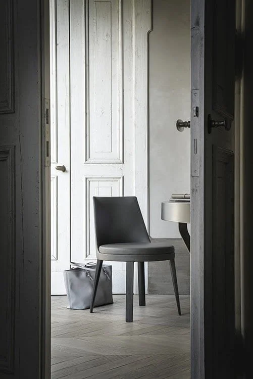 Frag Ponza Italian gray upholstered dining chair with modern silhouette at ArkNova Interiors Paphos showroom in Cyprus