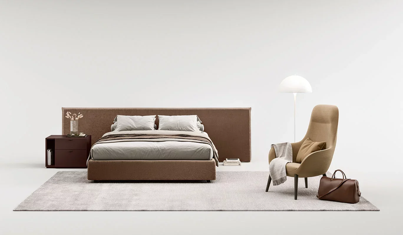 Italian Morfeo bed by Cinquepuntozero with rich brown upholstered headboard at ArkNova Interiors Paphos Cyprus