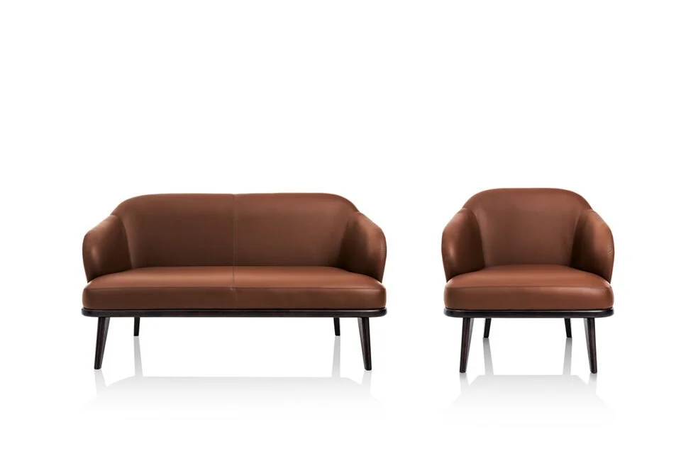 Albani Divani Leonora Italian brown leather armchair with matching loveseat at ArkNova Interiors Paphos showroom in Cyprus