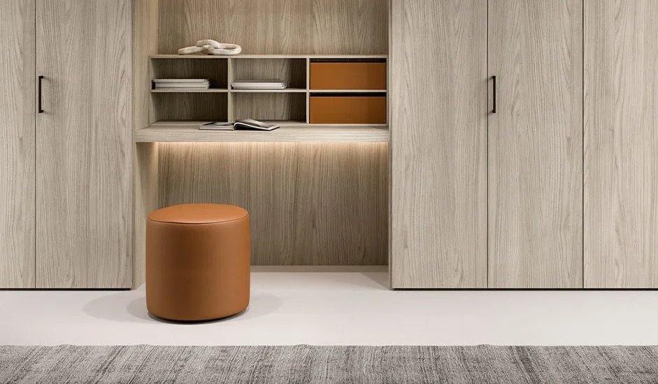 Italian Cinquepuntozero Meti 45 modern orange leather pouf with integrated desk at ArkNova Interiors Paphos showroom in Cyprus