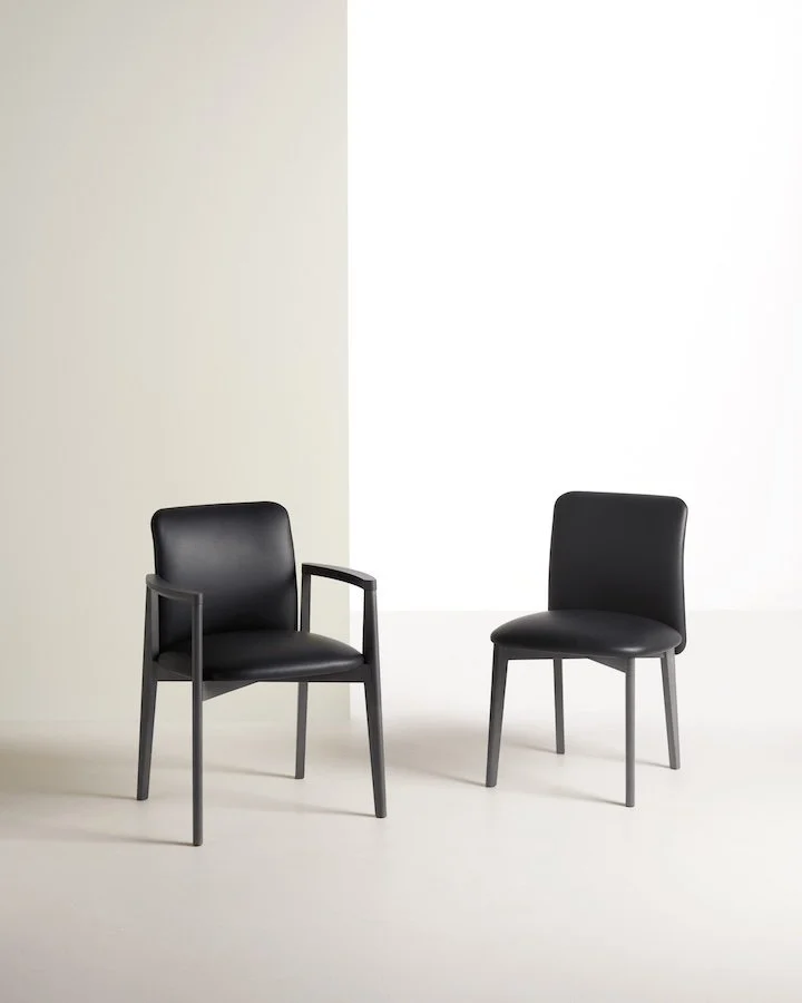 Frag Siloe W Italian black leather dining chairs with armrest and side versions at ArkNova Interiors Paphos showroom in Cyprus