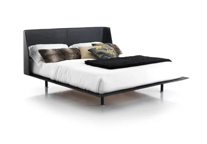 Italian Enrique bed by Albani Divani with bold black leather headboard and contemporary platform base at ArkNova Interiors Paphos Cyprus