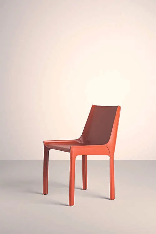 Frag Nisida Italian red leather dining chair with modern sculptural back at ArkNova Interiors Paphos showroom in Cyprus