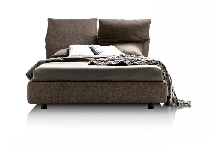 Italian Ventesimo bed by Albani Divani in rich brown fabric with bold headboard at ArkNova Interiors Paphos Cyprus