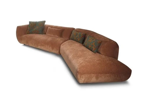 Miki Ferrari Tresor Italian brown L-shaped sectional sofa with patterned pillows, modern design at ArkNova Interiors Paphos showroom in Cyprus