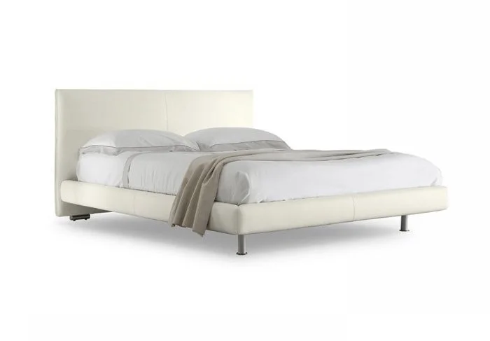 Italian Nicholas bed by Albani Divani with clean white leather upholstery and minimalist low profile at ArkNova Interiors Paphos Cyprus