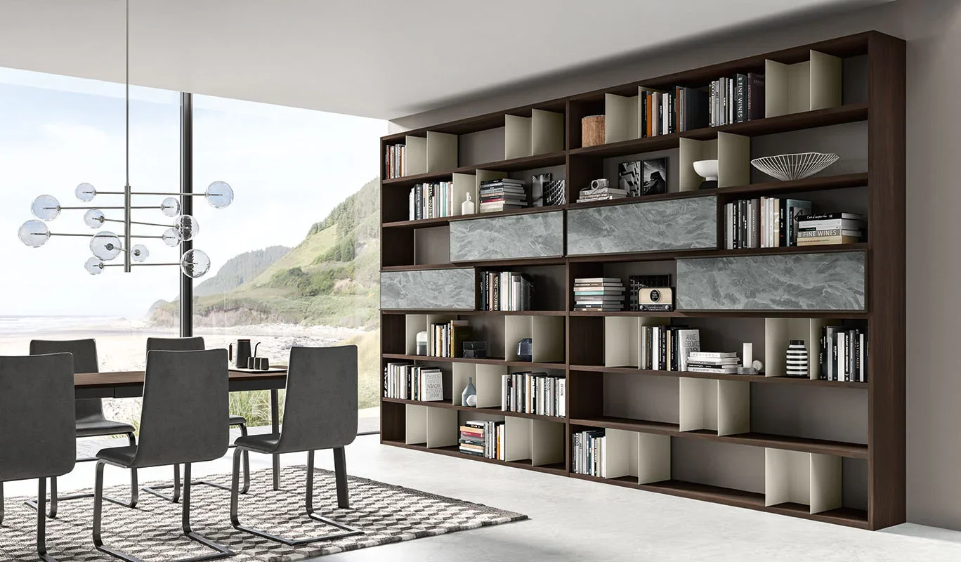 Cinquepuntozero BK08.1 Italian dark wood modular wall bookcase in open dining area at ArkNova Interiors Paphos showroom in Cyprus