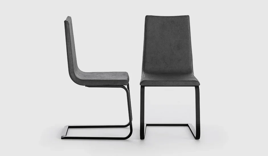 Cinquepuntozero Schwinger Italian gray fabric cantilever armchair with black metal base at ArkNova Interiors Paphos showroom in Cyprus