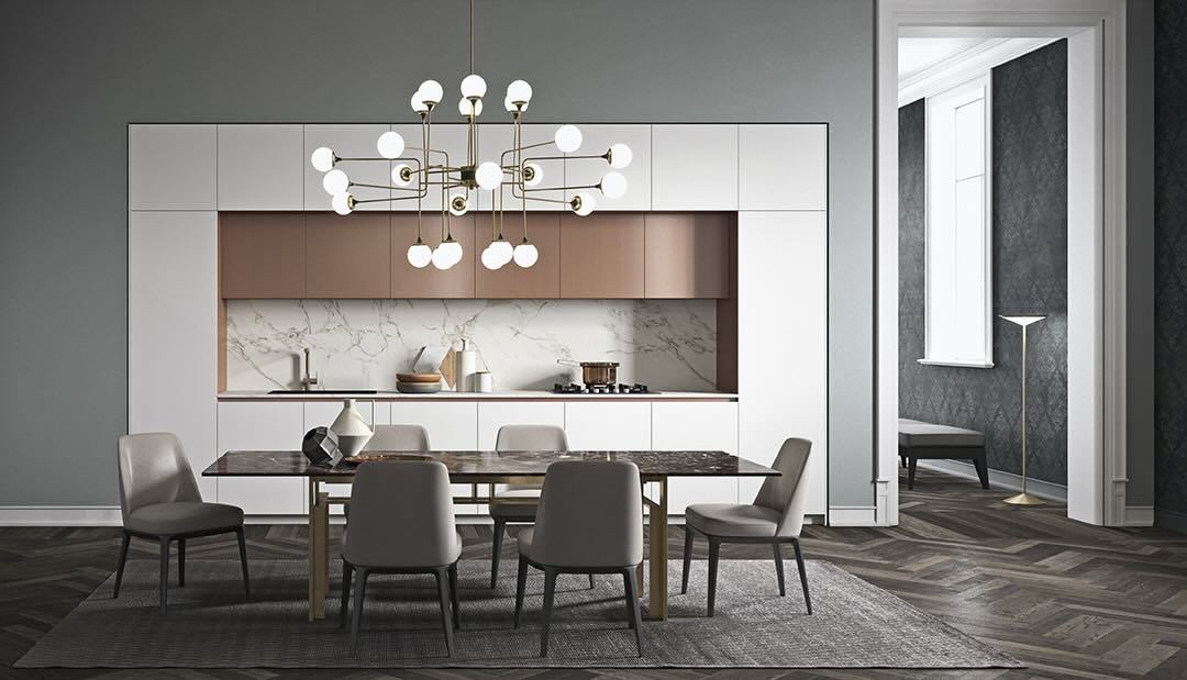 Antares Cucine ZEN Plus Italian integrated kitchen and dining area with white and bronze cabinets, marble backsplash, marble dining table and modern gold chandelier – by ArkNova Interiors in Paphos Cyprus