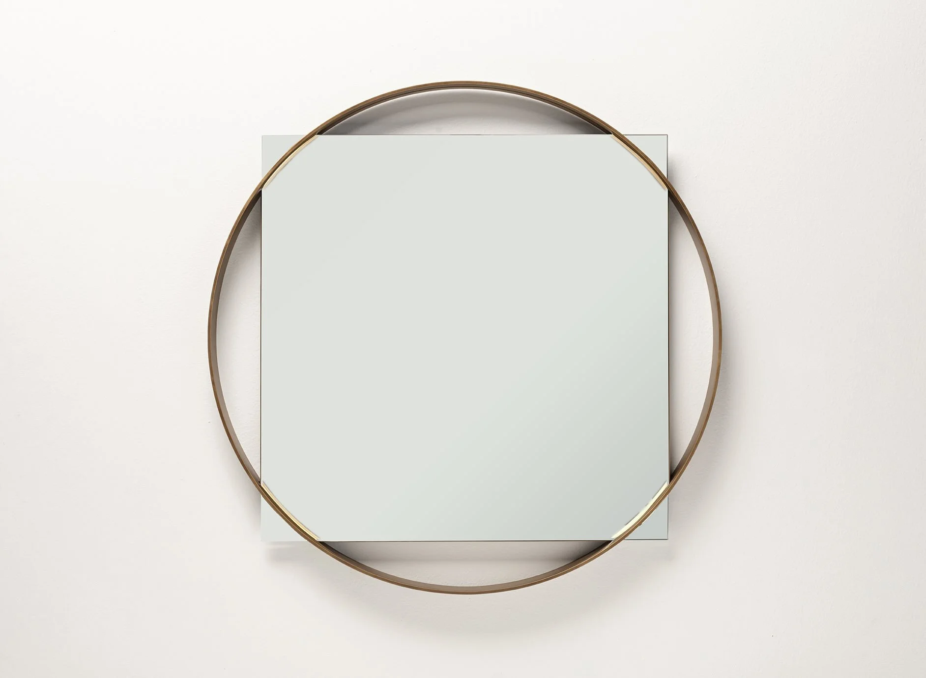 Italian Frag Twin One round brass-framed wall mirror at ArkNova Interiors Paphos showroom in Cyprus