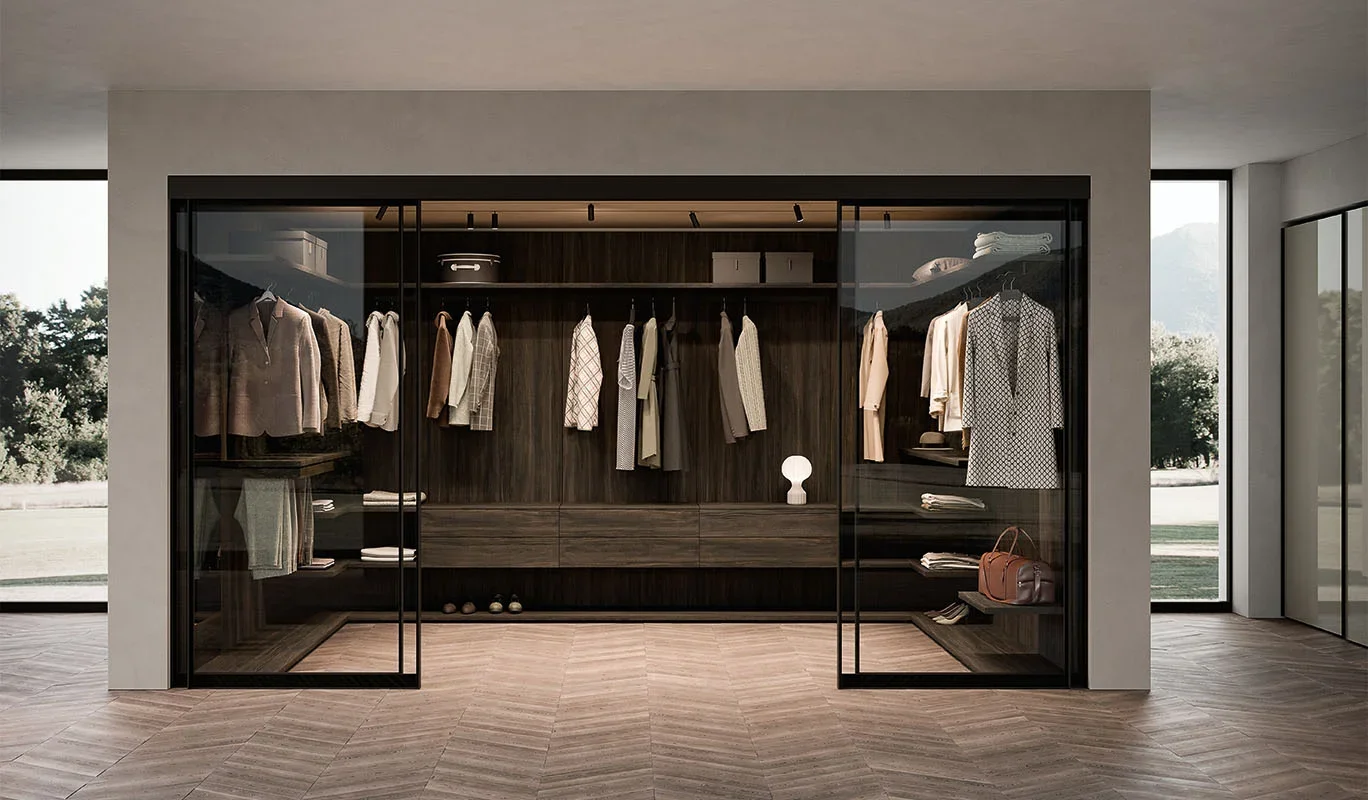 Italian Cinquepuntozero Wall System glass-enclosed walk-in closet with dark wood interior at ArkNova Interiors Paphos Cyprus