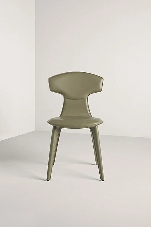 Frag Ele Italian green leather dining chair with sculpted back at ArkNova Interiors Paphos showroom in Cyprus
