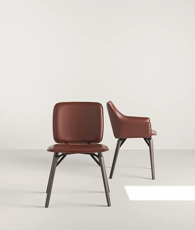 Frag Iki PW Italian brown leather dining armchair with wooden legs and black metal frame at ArkNova Interiors Paphos showroom in Cyprus