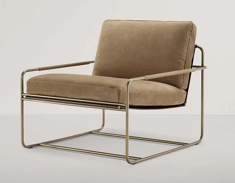 Frag Riviera Italian beige fabric armchair with brass metal frame at ArkNova Interiors Paphos showroom in Cyprus