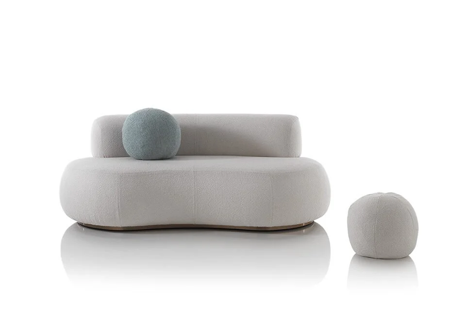 Albani Divani Numana Italian light gray curved loveseat with matching pouf, modern design at ArkNova Interiors Paphos showroom in Cyprus
