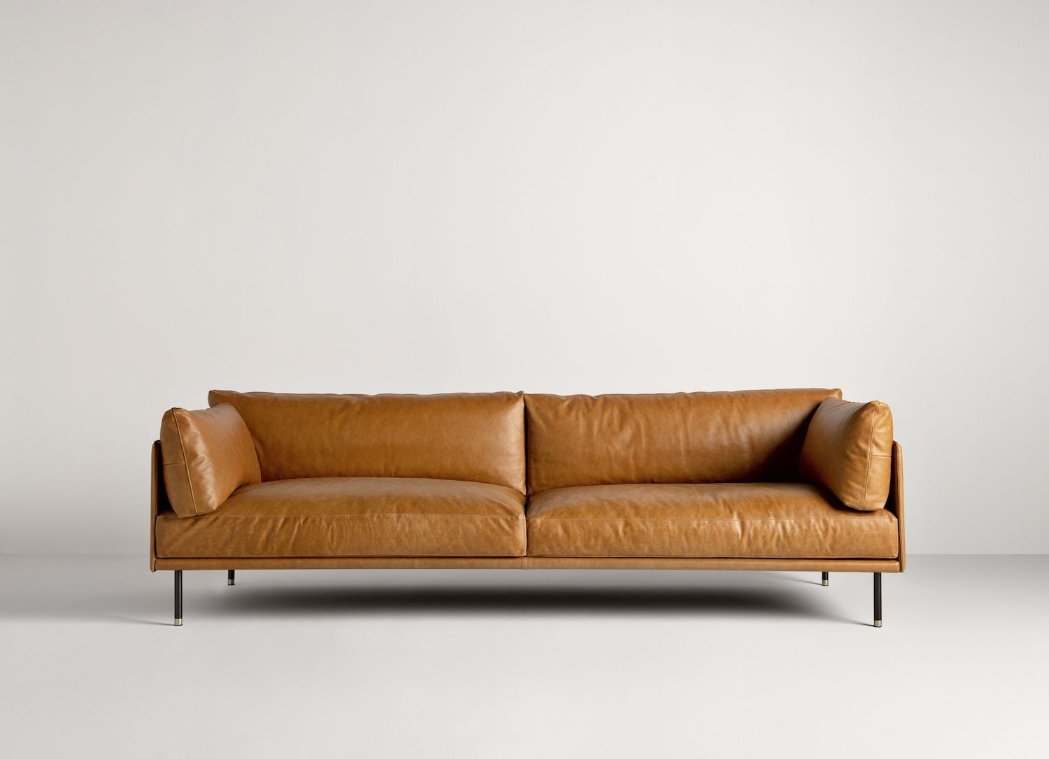 Frag Wilton Italian brown leather three-seater sofa with black legs, modern design at ArkNova Interiors Paphos showroom in Cyprus