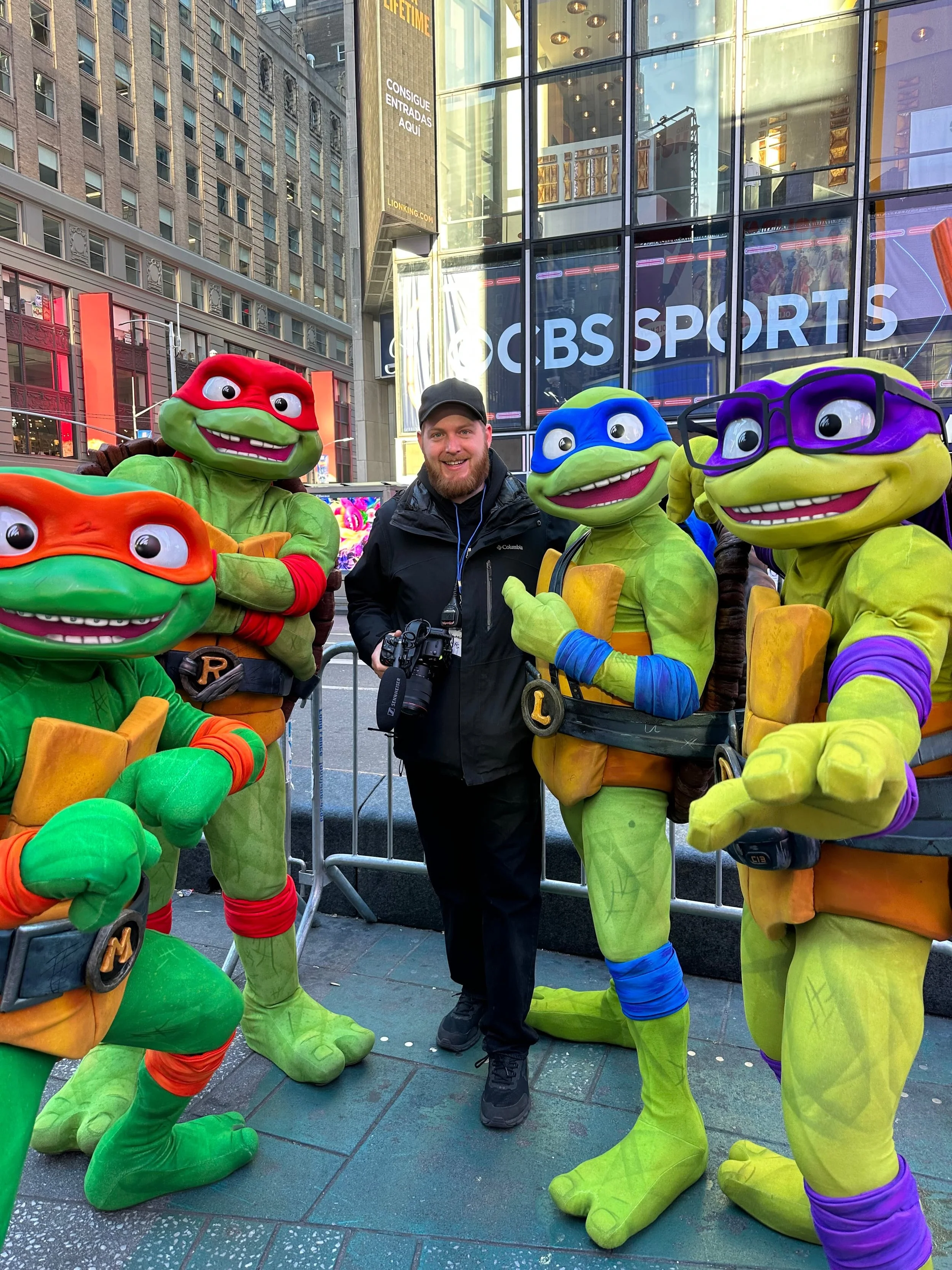 Andrew Henkelman and the Teenage Mutant Ninja Turtle outside of Paramount Global's International Headquarters in Time Square, New York.