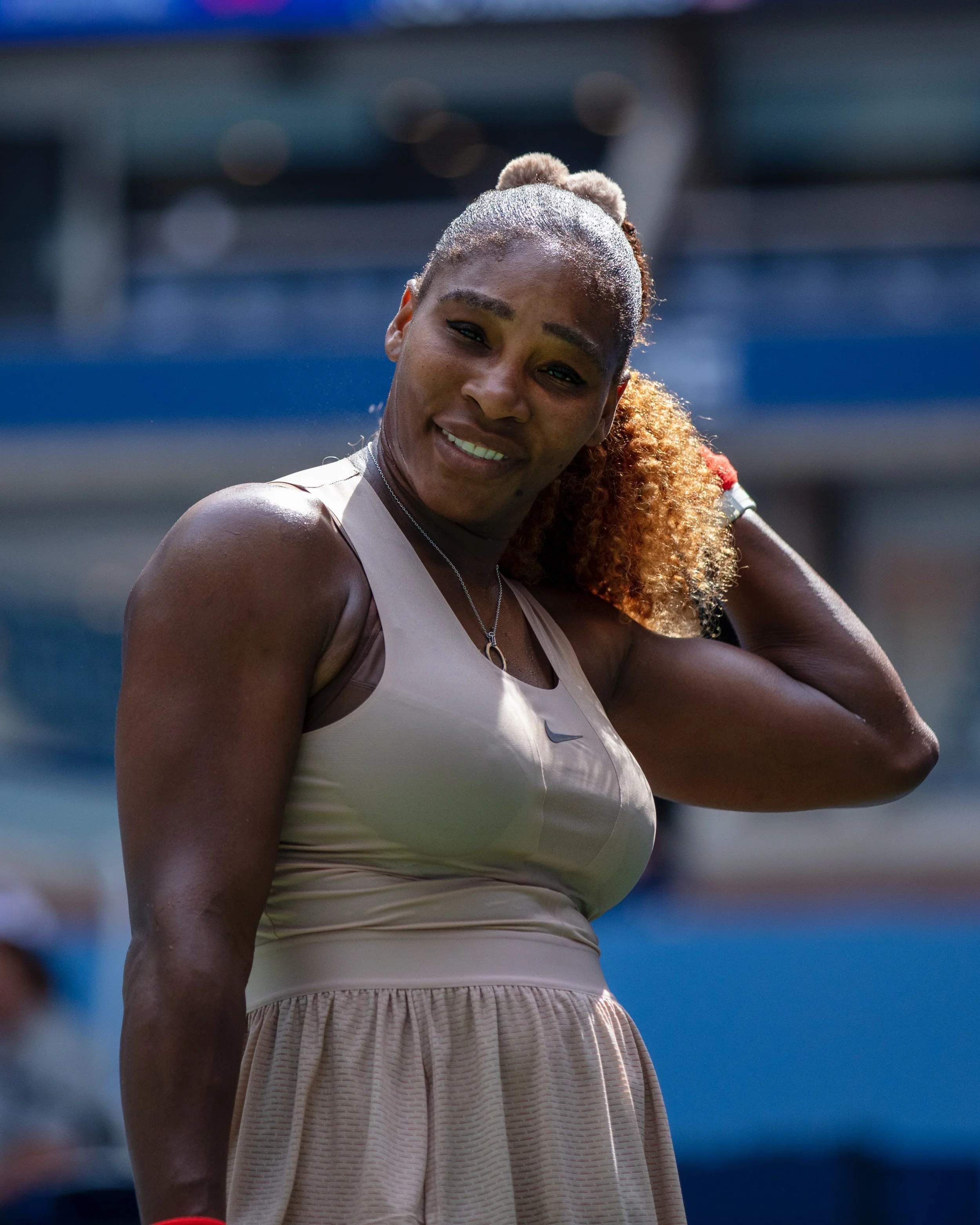 Close-up of a  Serena Williams standing outdoors under sunlight at the U.S. Open Tennis Championships