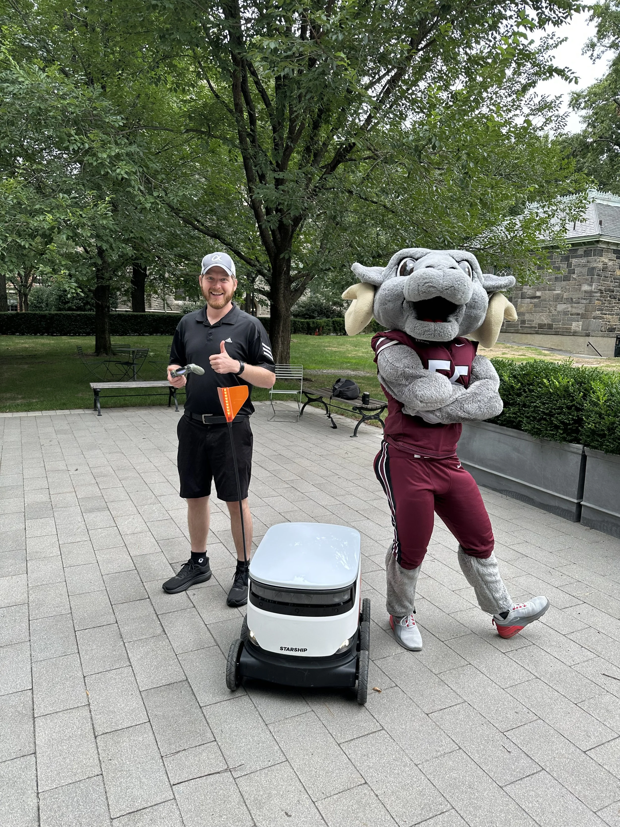 Fordham University Mascot and Andrew Henkelman working with Starship Technologies to create content during their AI Robotic rollout on campus.