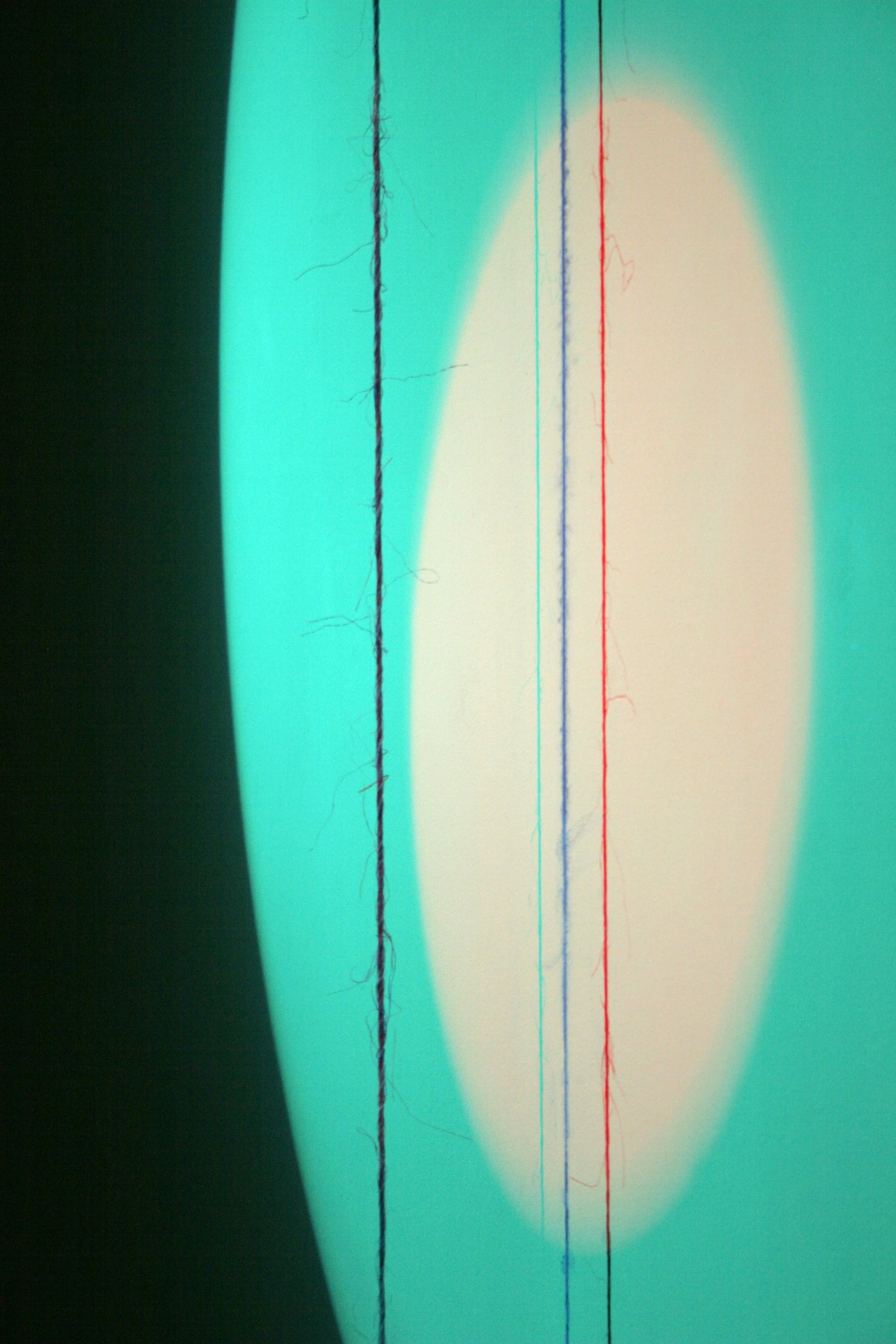 Close-up photo of an eye with visible blood vessels and a bright, oval-shaped reflection of light.