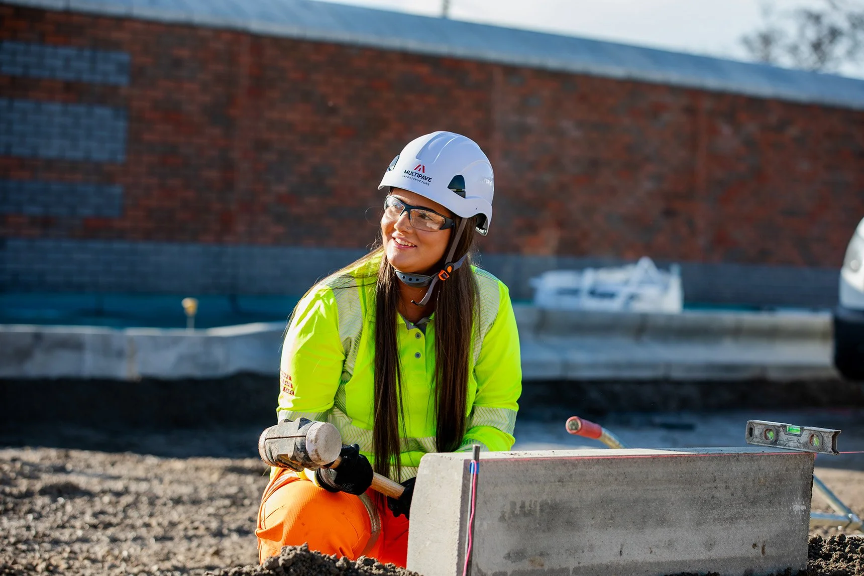 White female with full PPE on working on site