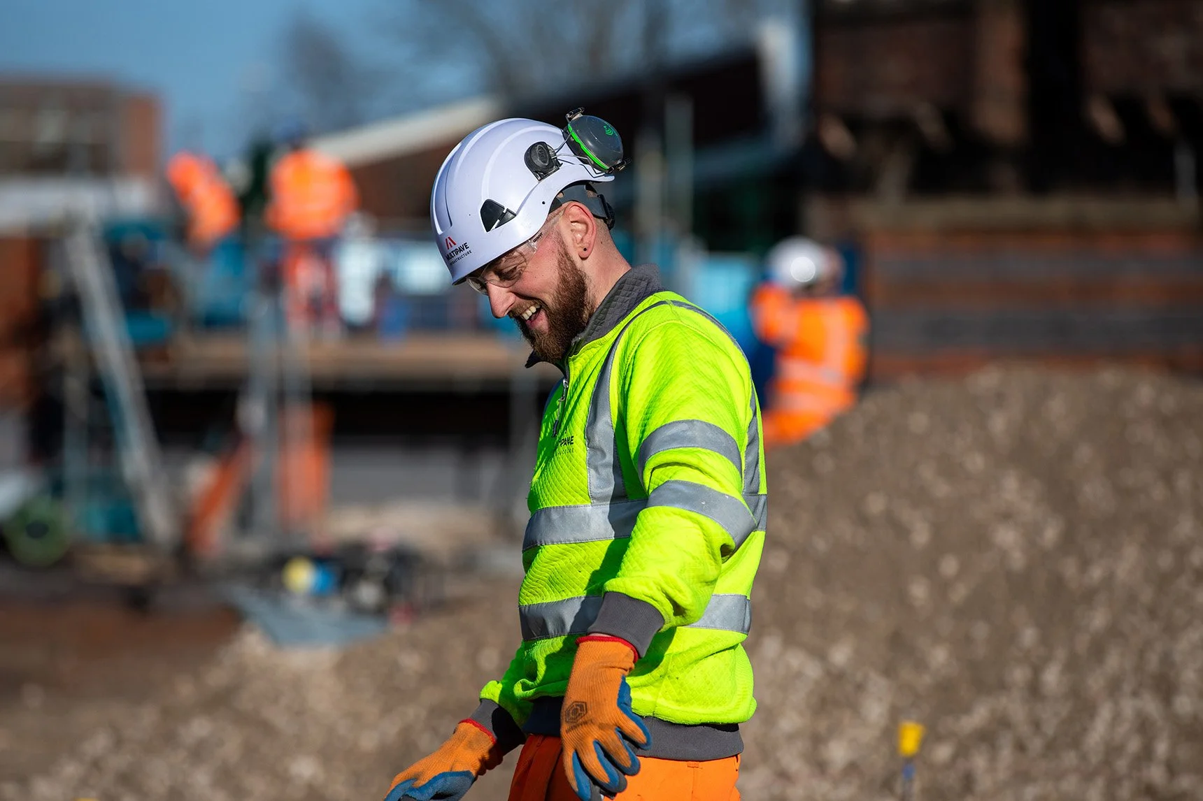 White male with full PPE on working on site
