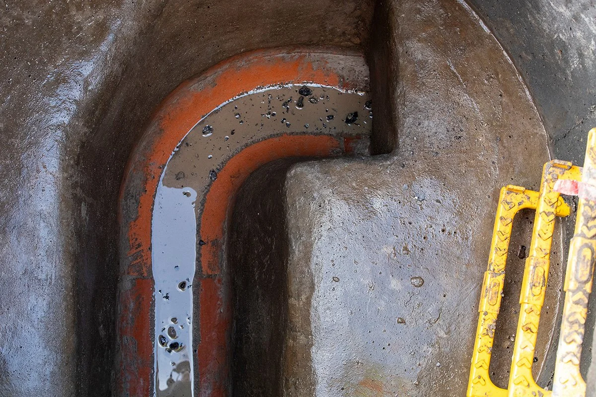 Image of a drainage system with yellow step ladders to the right