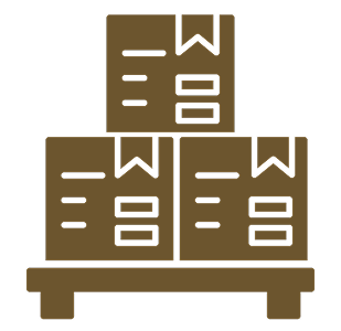Three cardboard boxes stacked on a wooden table, with one box on top of two, all with shipping labels and barcodes.