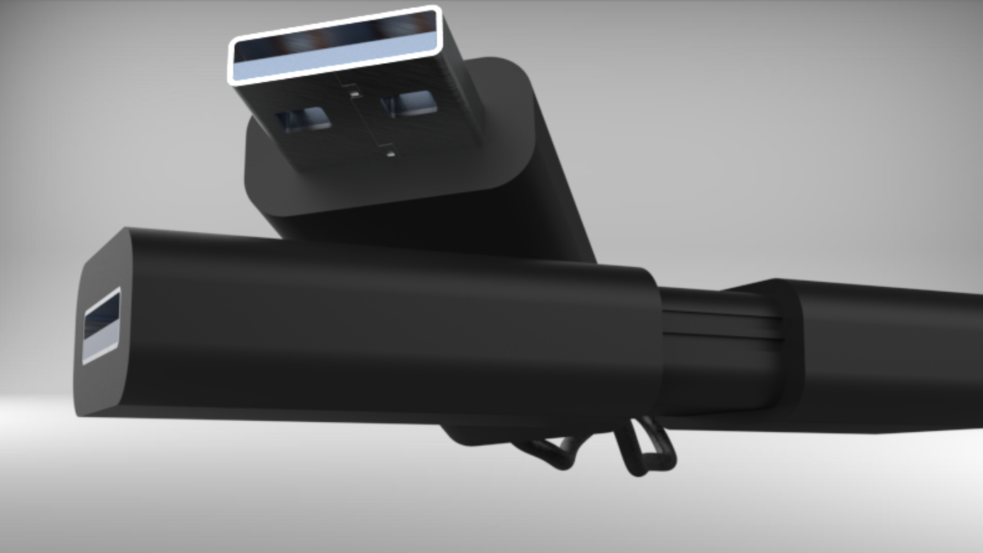 Close-up of a black electronic device with USB ports on a gray background.