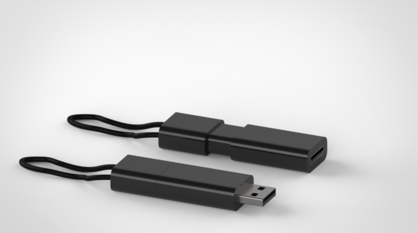 Two black USB flash drives with attached lanyards on a white surface.