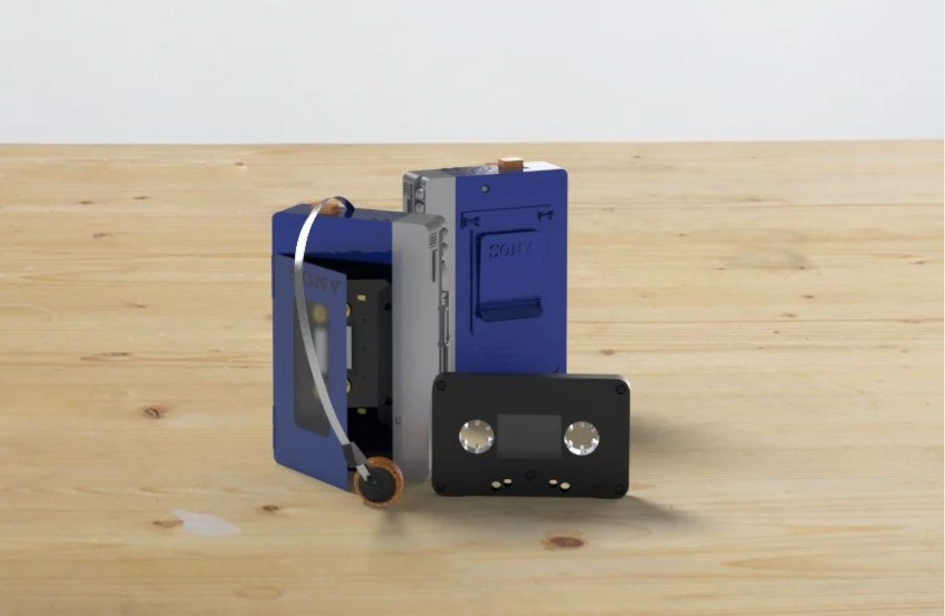 A retro cassette tape with parts of the tape reel and casing removed, placed on a wooden surface.