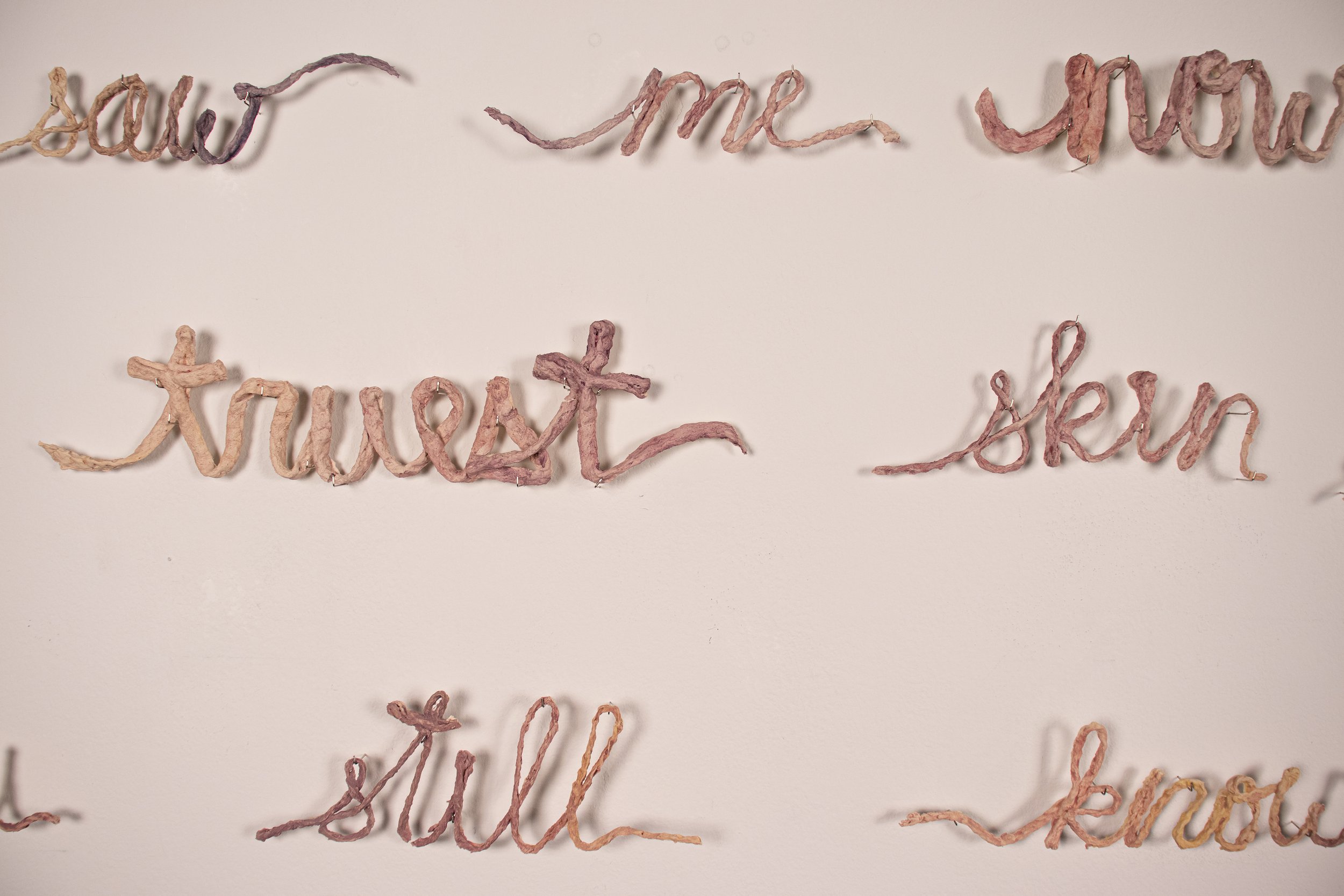 "Molting" (poem - detail)
2025
Slip-cast crocheted yarn, water color paint