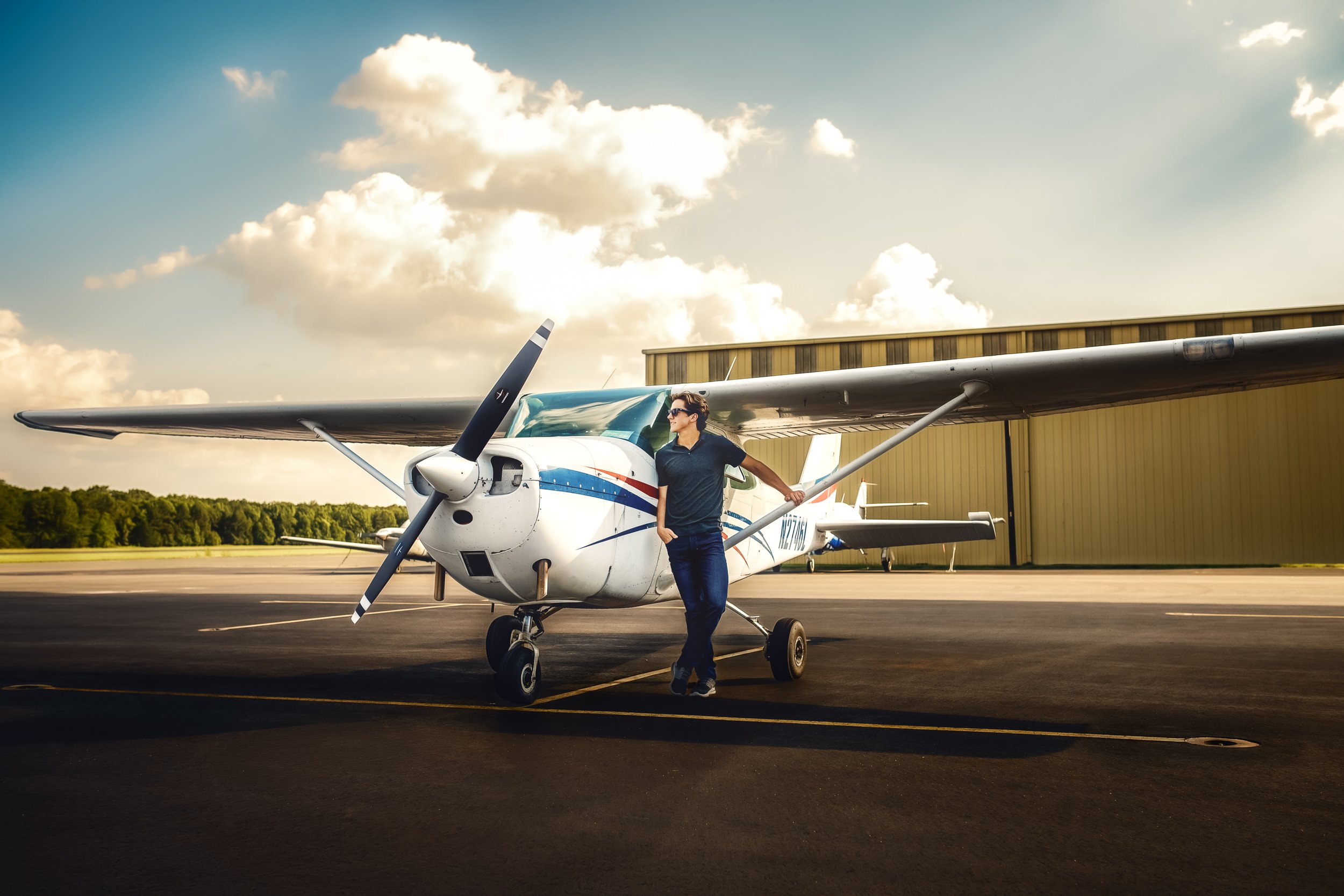 zach-pilot-senior-session-monroe-executive-airport-1.jpg