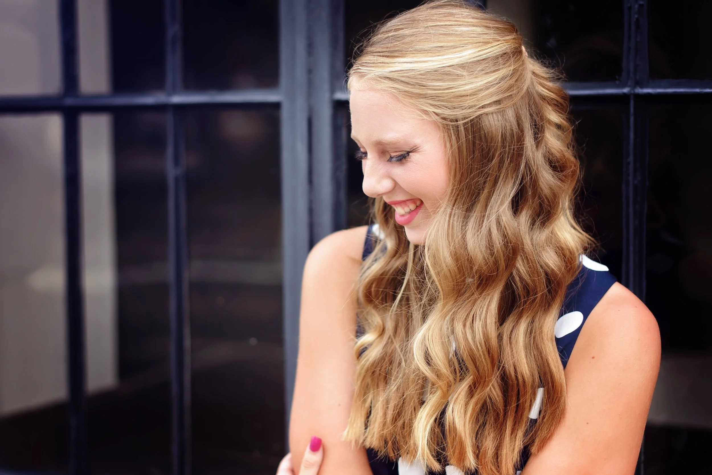 Natural light senior portrait near window