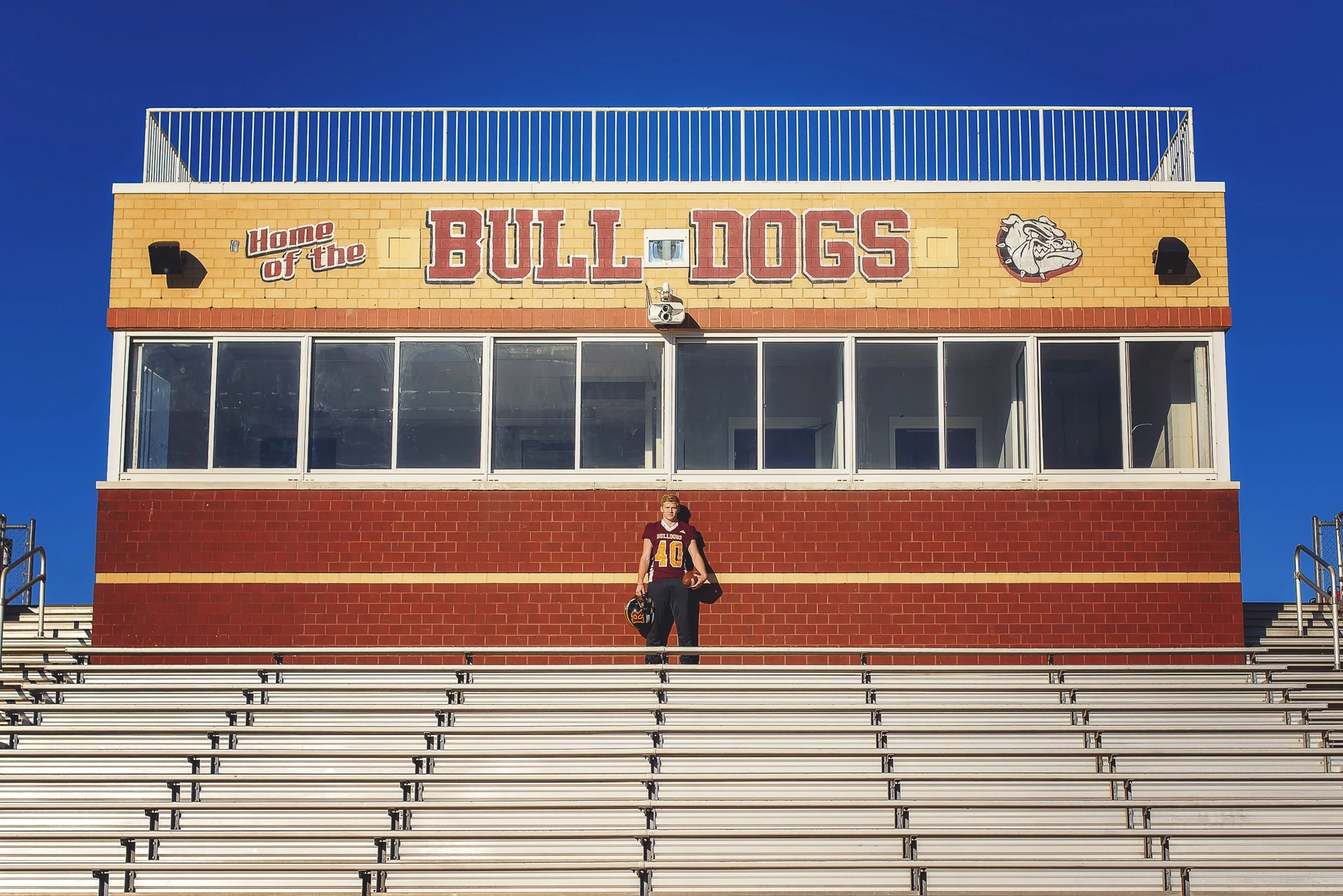 high school football player photographed at jay m robinson football stadium